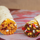New $1 Grande Burritos will hit Taco Bell’s value menu this month.